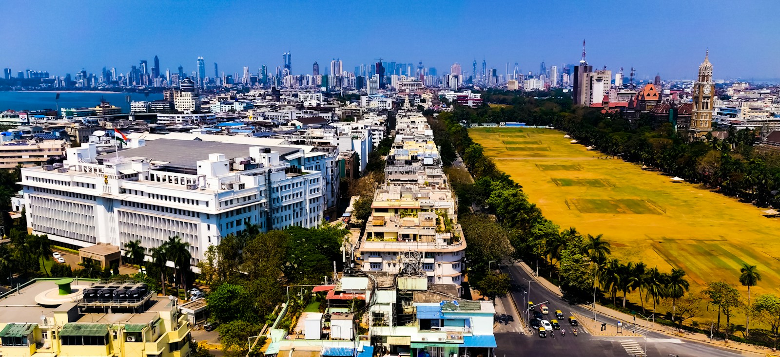 An aerial view of Mumbai neighbourhoods, green spaces, and the waterfront